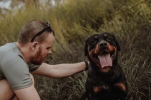 A dog dad bonding with his dog outdoors — inspiration for personalized dog dad gifts