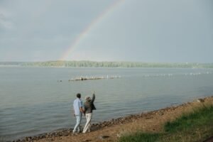 A rainbow over a peaceful sky, symbolizing the Rainbow Bridge for a lost pet